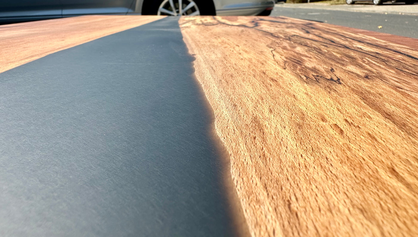 Epoxidharz River Couchtisch Kürten Buche massiv 110 cm Massivholz geölt mit Spider Metall Gestell schwarz