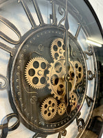 Lade das Bild in den Galerie-Viewer, Wanduhr Zahnrad Berlin Zählwerk Animation schwarz 55 cm
